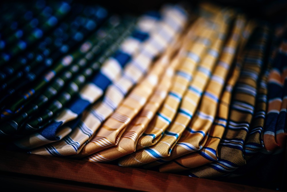 Luxurious Ties - Beauty & Fashion Like Save Choosing and trying a tie on at clothing store.
