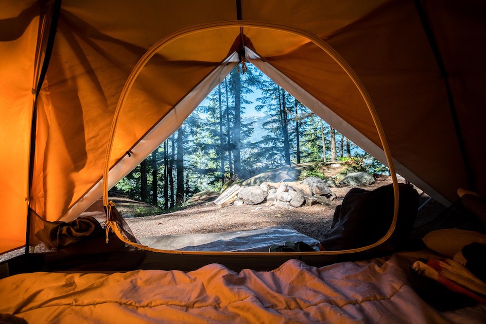 Waking up inside a tent during a camping trip