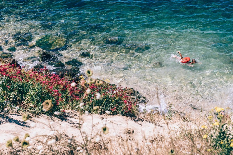 boy swimming in the sea on a hot summer day