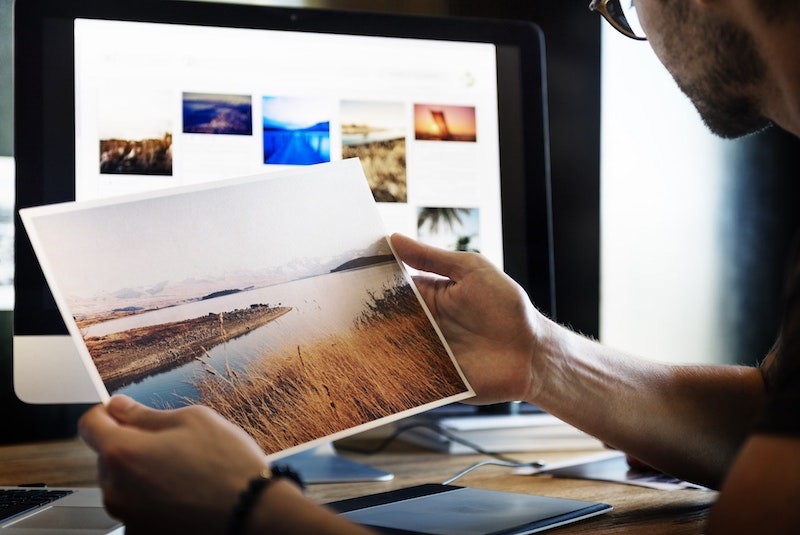 Man holding his printed photograph