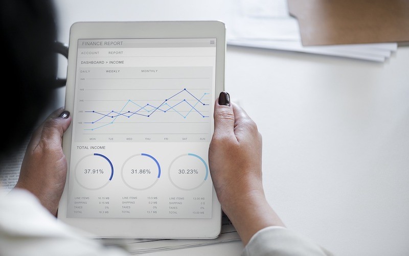 Woman Looking at a Financial Report