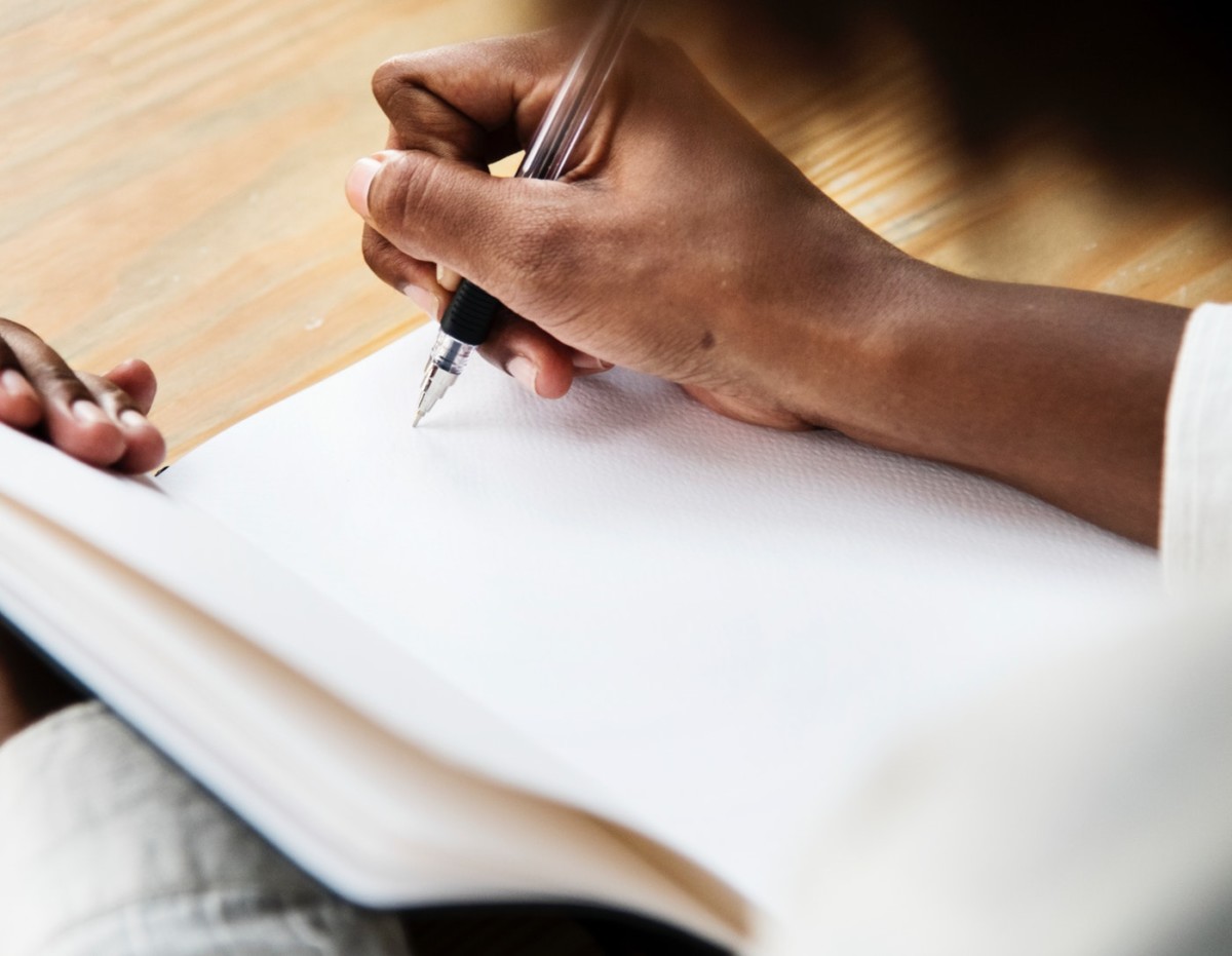 Girl writing in a journal