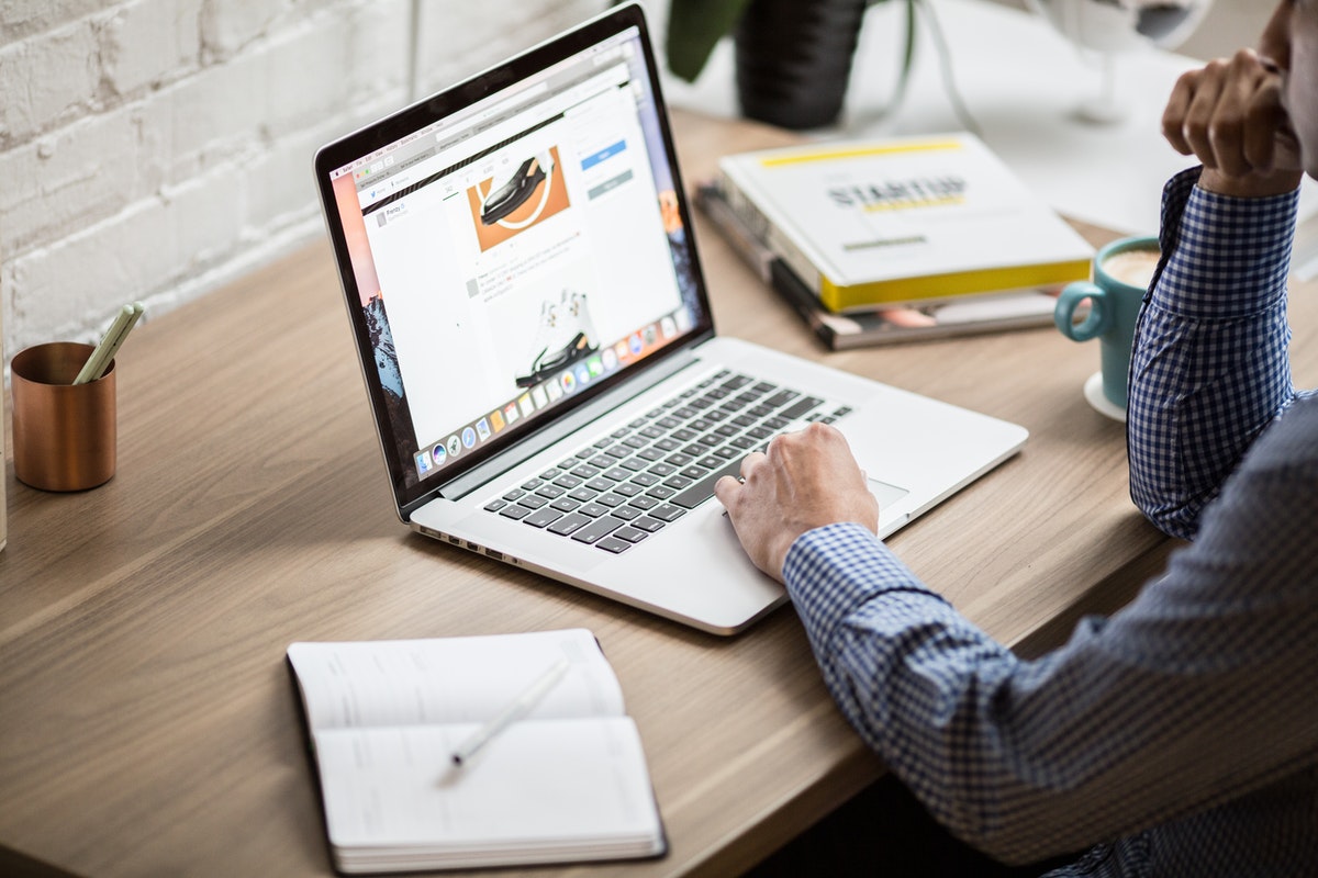 man working on his website from home