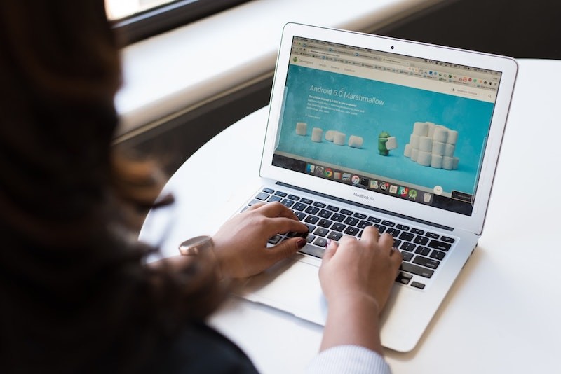 Woman using a macbook pro