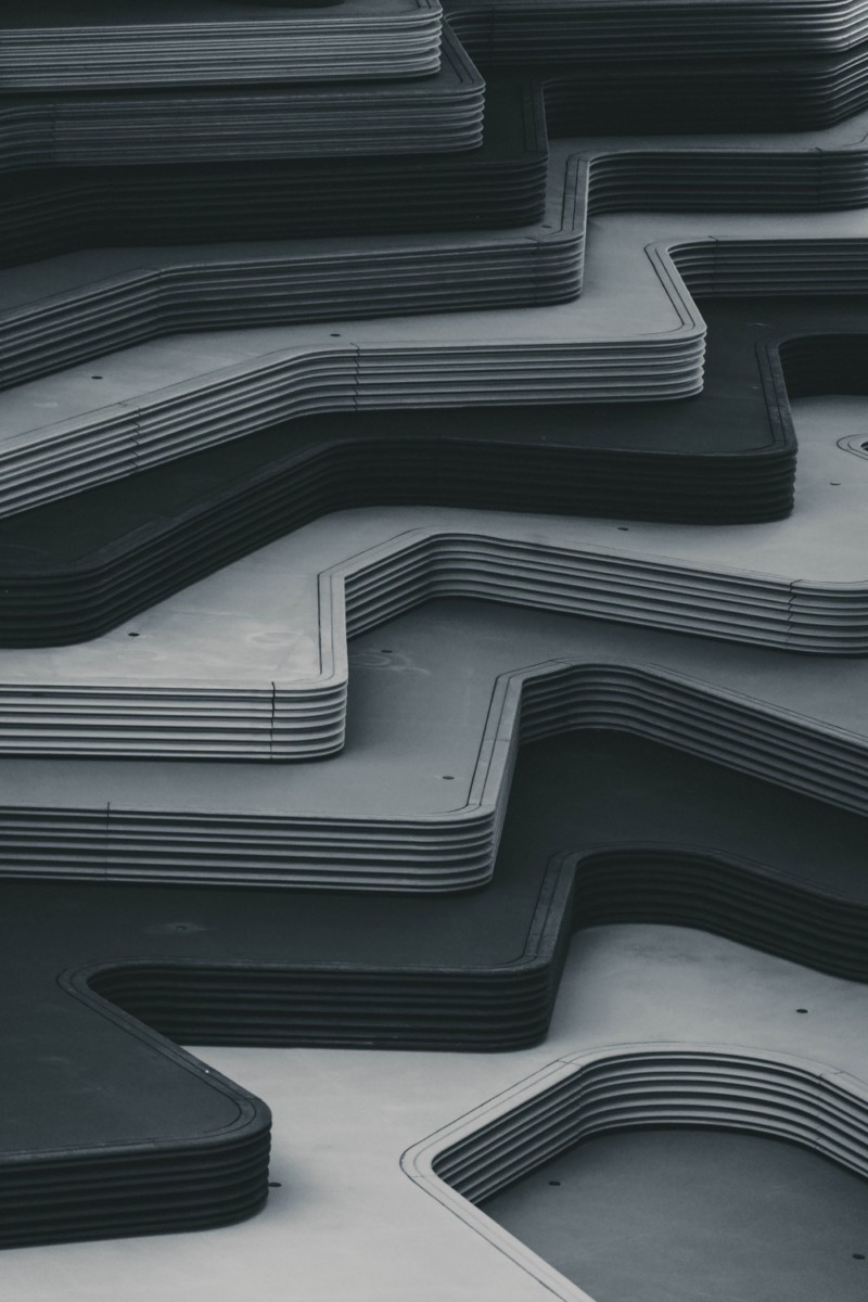 Architecture Photography of Grayscale Concrete Stairs Shaped like Waves