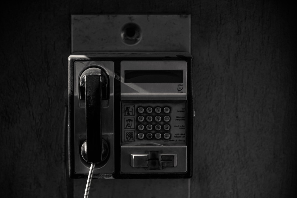 Black and White Photography of an Old Payphone