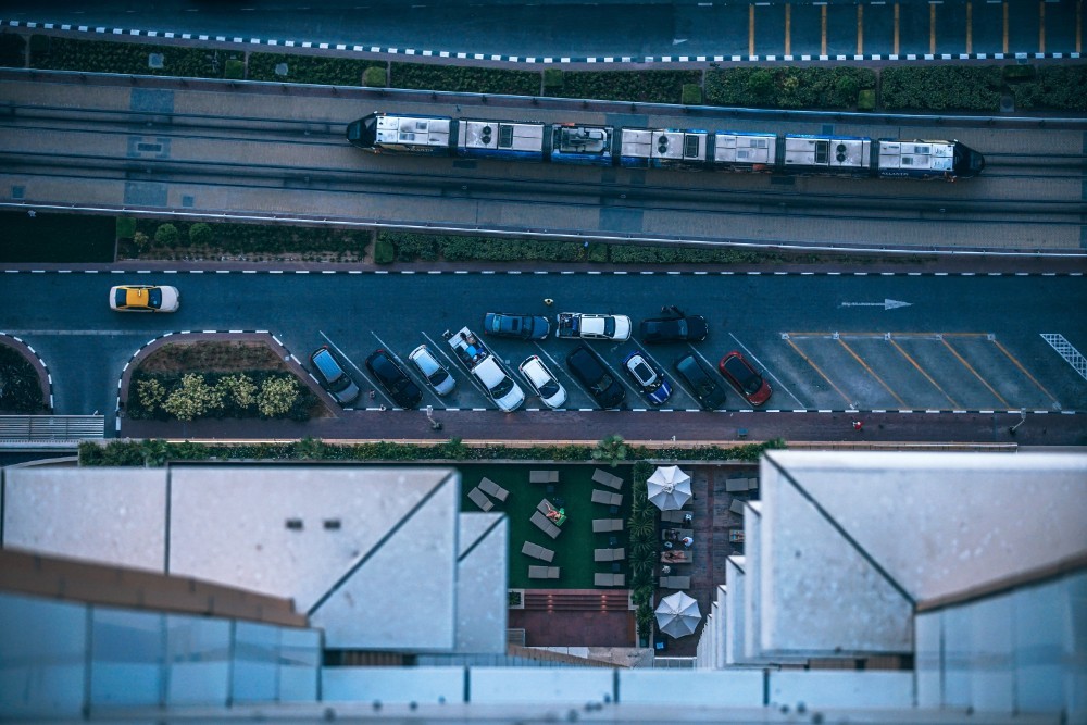 Downwards View from the 66th Floor Looking at Cars and Train