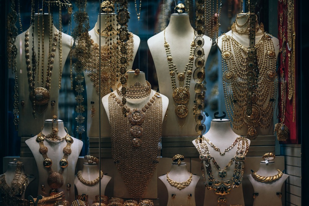 Golden Jewelry and Necklaces placed on Mannequins for Sale