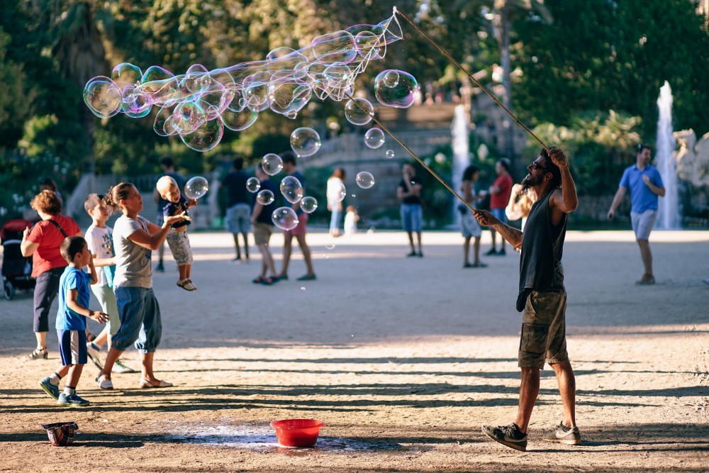 Man Blowing Soap Bubbles in the Barcelona Park