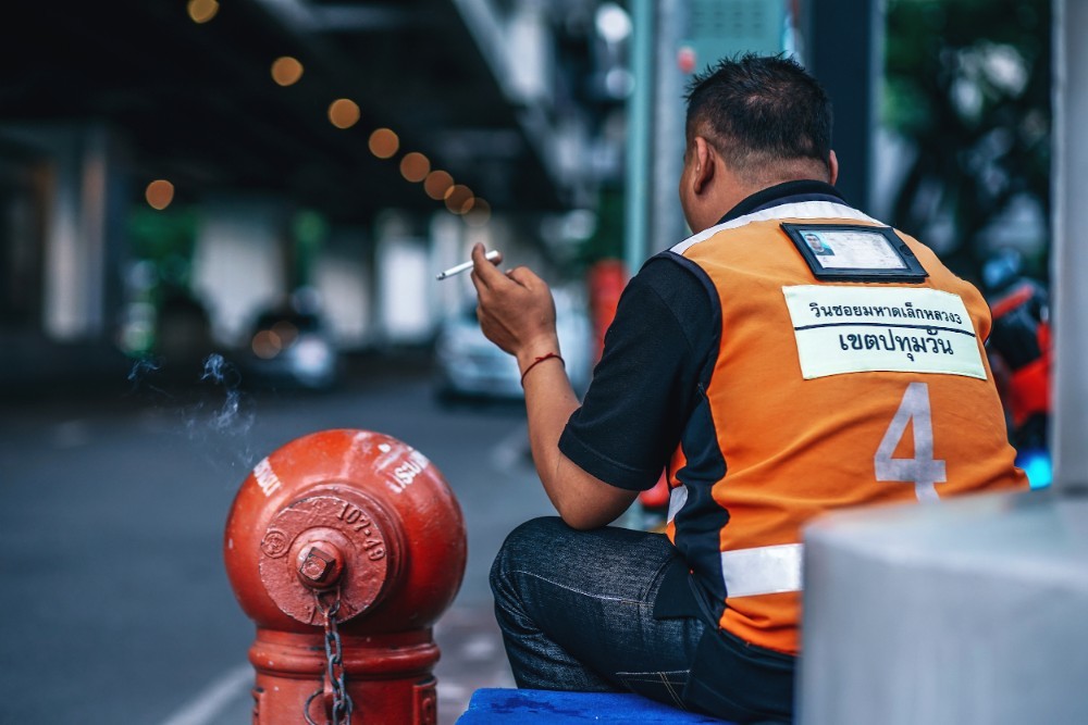 Motorbike Taxi Driver on a Cigarette Break