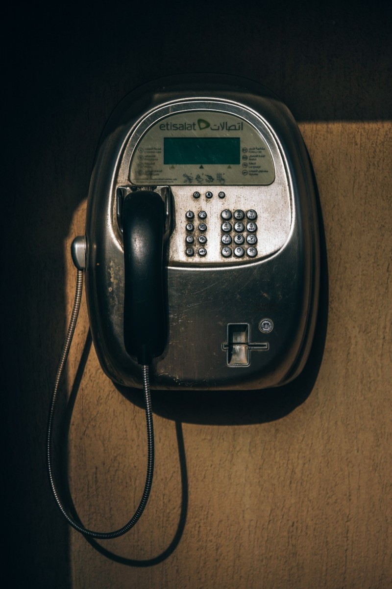 Old Black Payphone attached on a Wall in Dubai