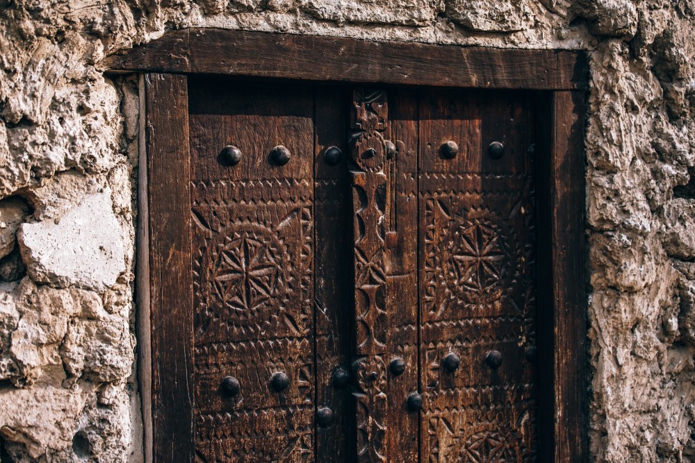Vintage Wooden Door with Carved Symbols