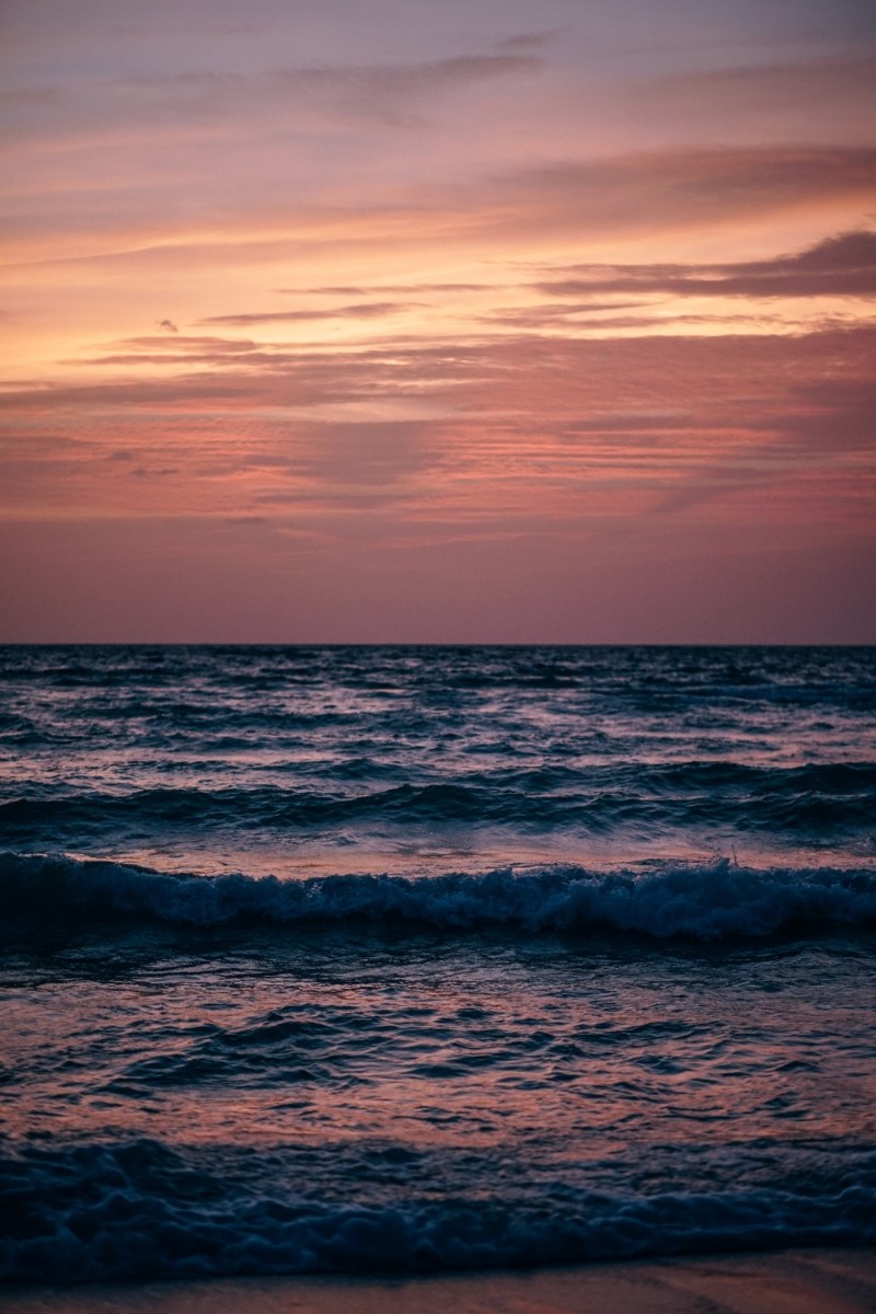 Stunning Orange and Purple Sunset above the Sea in Thailand