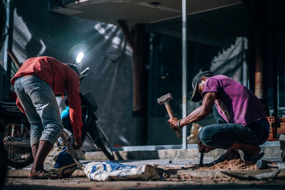 Two Cambodian Men working on a Construction Site