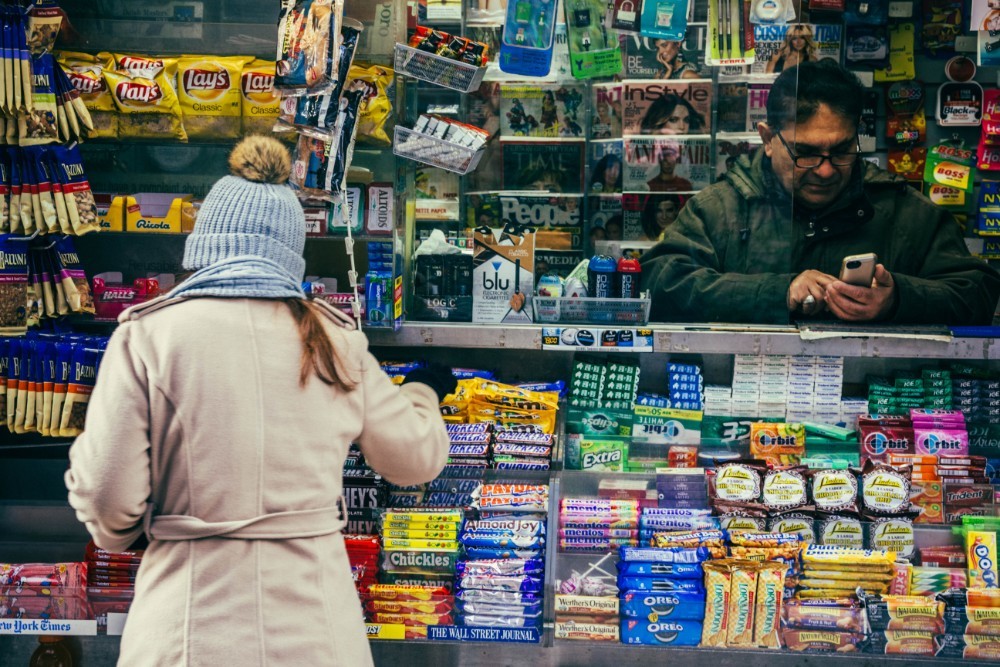Woman Shopping for Candy at a Convenience Store