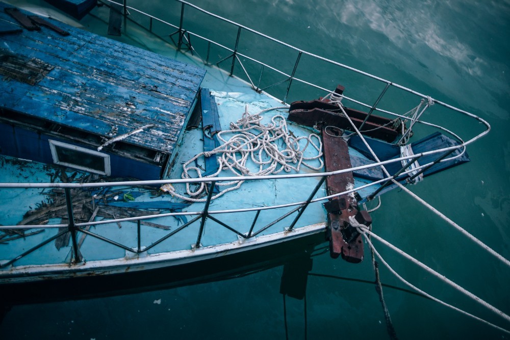 Abandoned Blue Boat Photographed from Above
