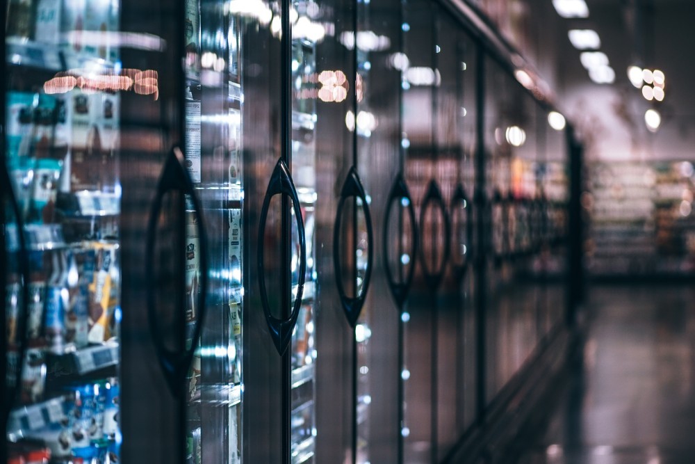 Aligned Freezers full of Organic Products at a Grocery Store