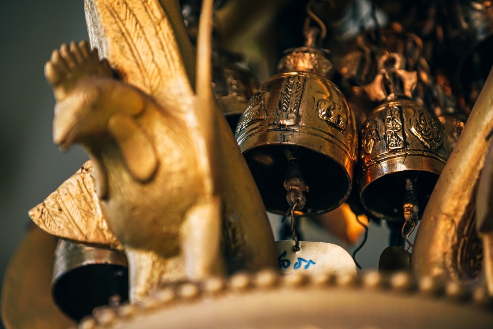 Close up Shot of Golden Brass Bells at a Thai temple