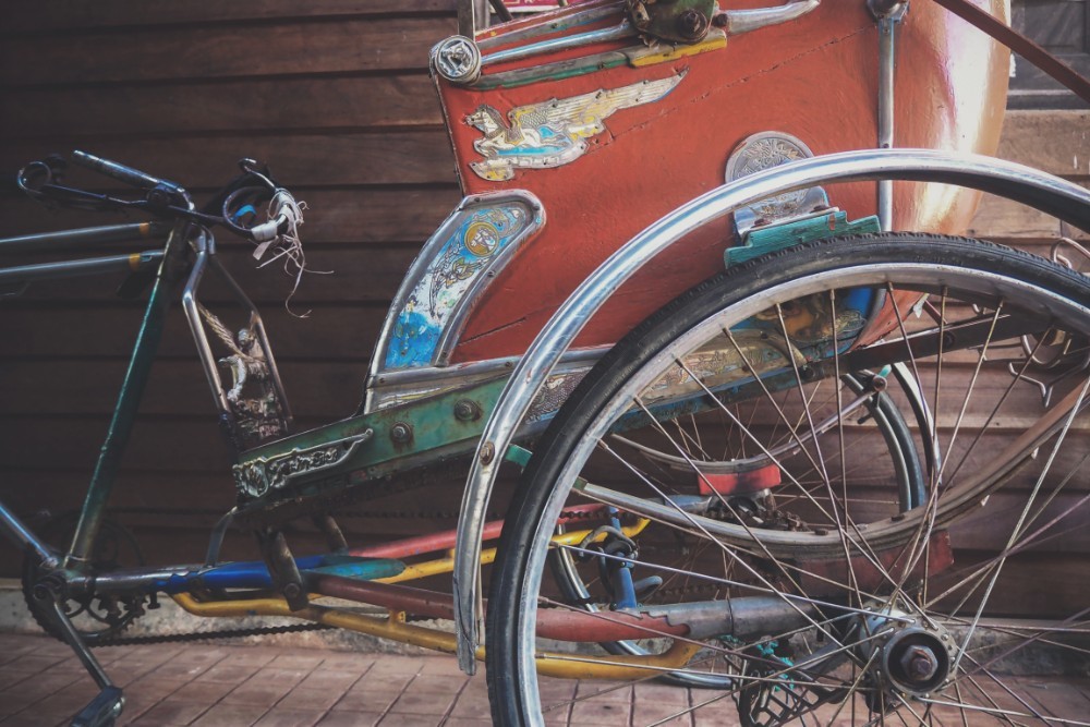 Colorful and Vintage Tricycle with a Red Backseat