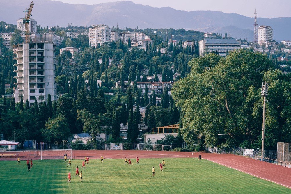Football Pitch in Yalta Photographed with the City and the Mountains in the Background