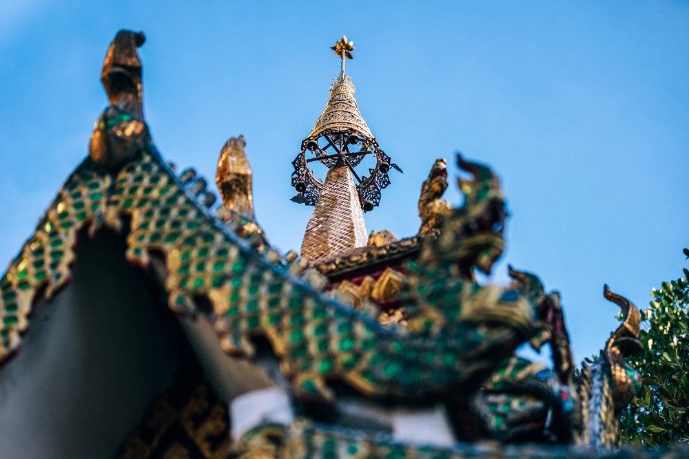 Golden Tip of a Dragon Temple with the Blue Sky in the Background