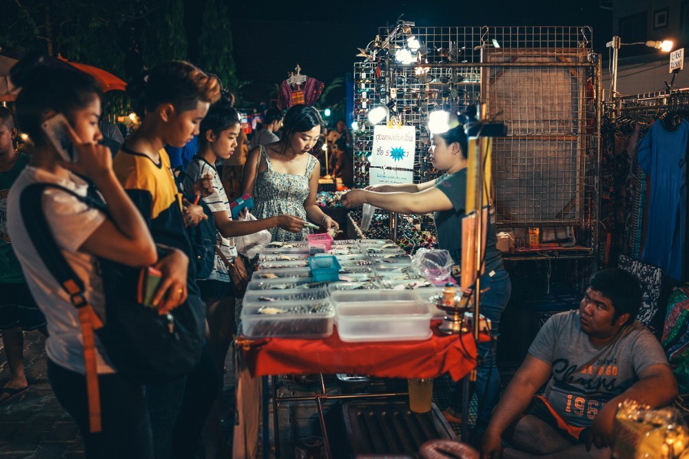 People Checking Out Handmade Jewelry at the Chiang Mai Night Market