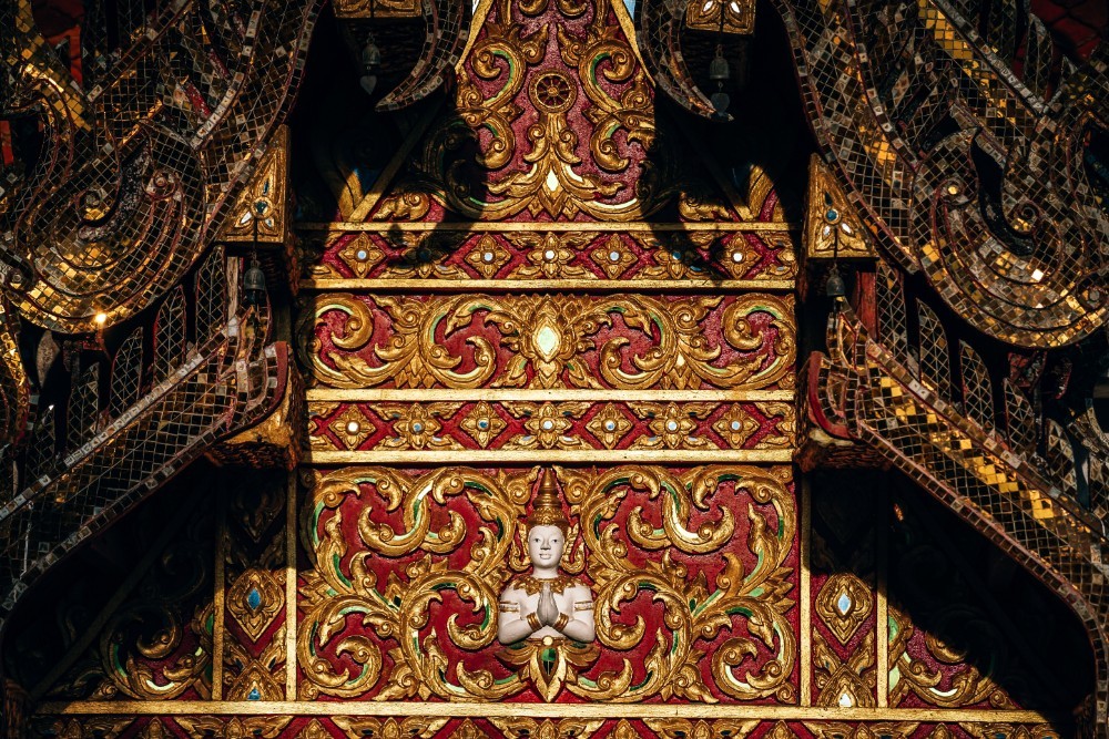 Red and Golden Decorations at a Thai Temple Rooftop