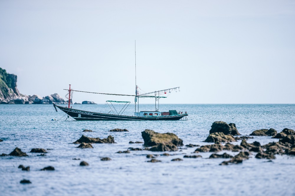 Small Thai Fishing Longtail boat at Thong Nai Pan Yai Beach