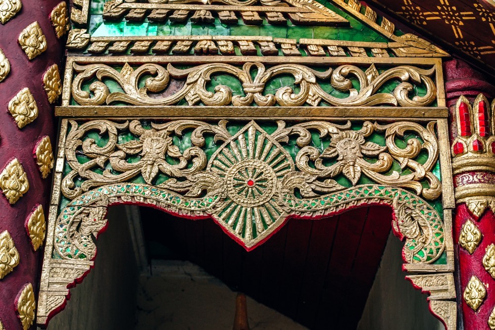 Thai Temple Entrance with Golden Decorations