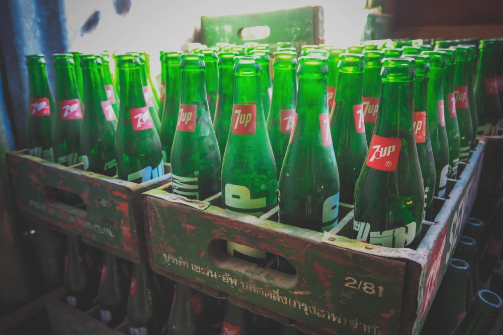 Vintage 7Up Glass Bottles in a Wooden Storage Crate