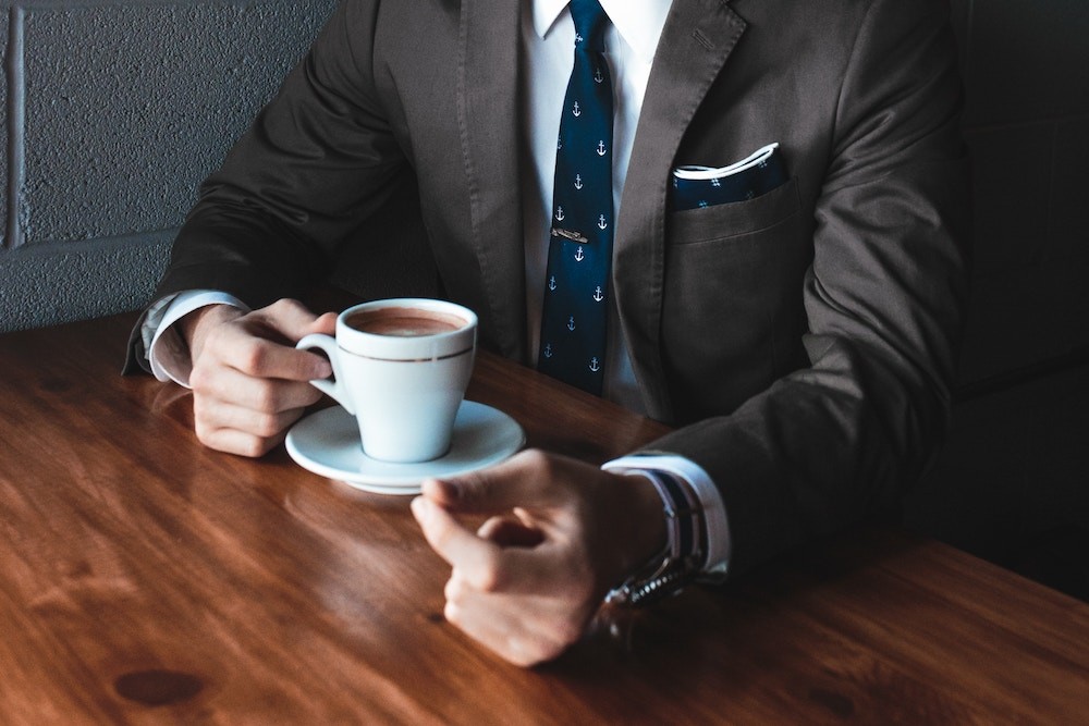 a man drinking coffee