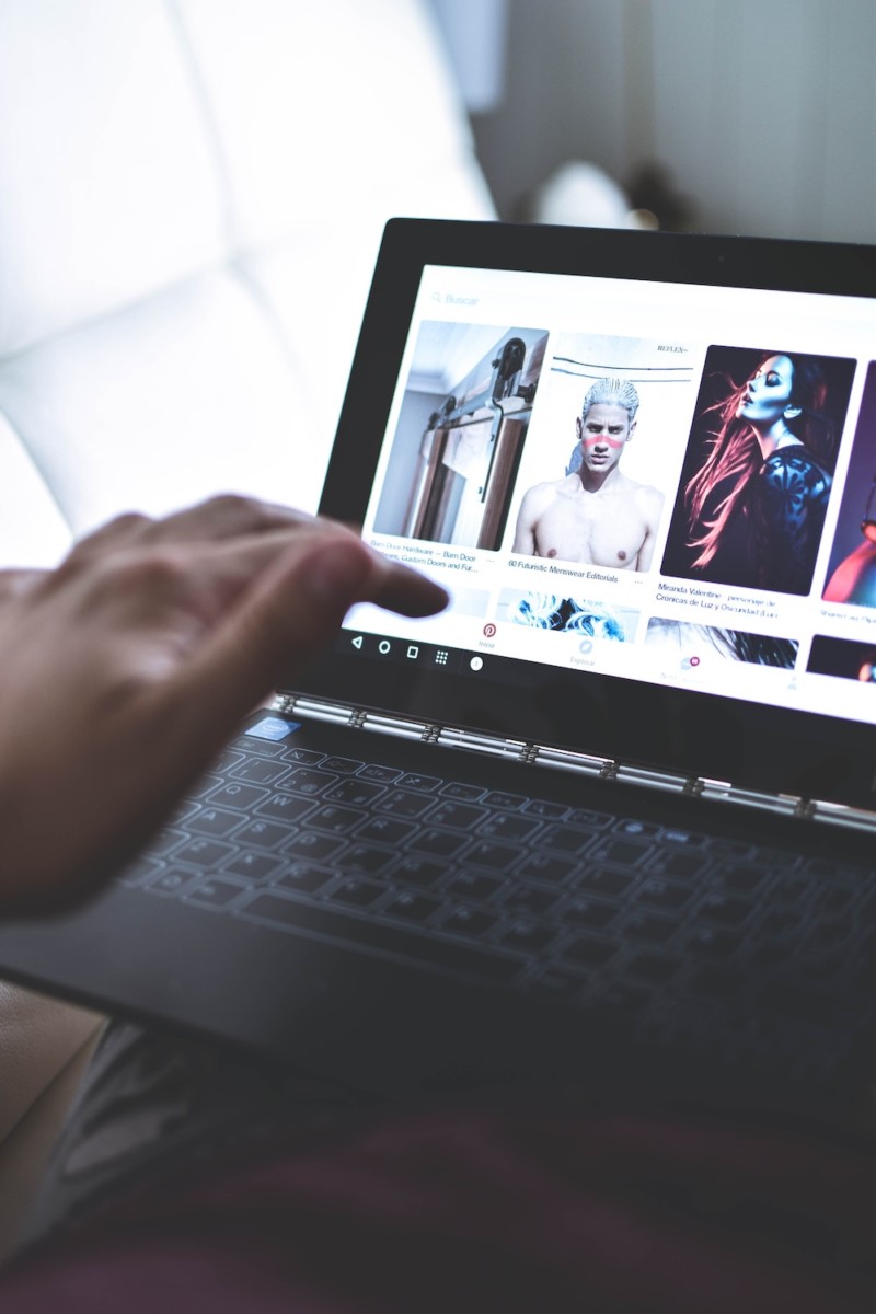 a man typing on computer