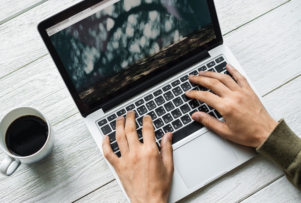 person using laptop computer