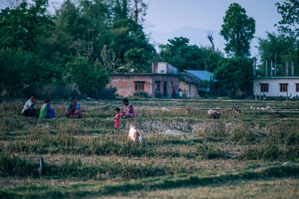 Nepali Family Enjoying the Weather at a Village Field