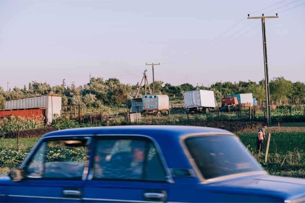 Old Blue Car Driving Around a Country Side in Crimea