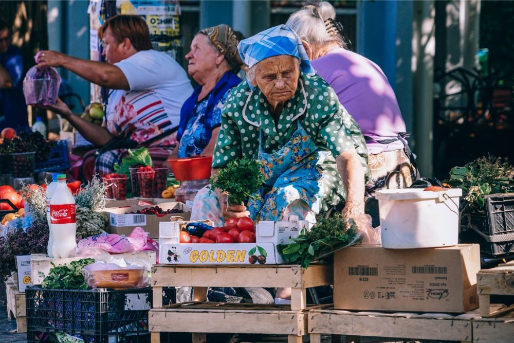 Old Lady Selling Herbs at the Farmers Market