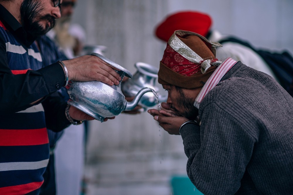 People Drinking Holy Water at Gurudwara Bangla Sahib