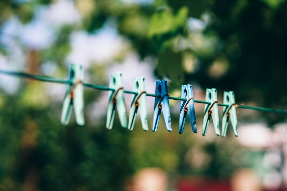 Plastic Clothes Pegs on a Clothesline