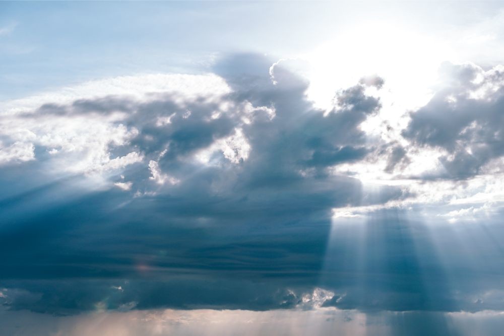 Rays of Sunshine Passing Through Fluffy Clouds