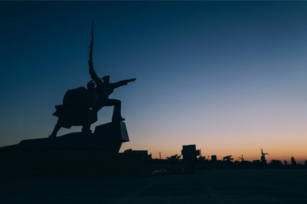 Silhouette of a Statue during Sunset