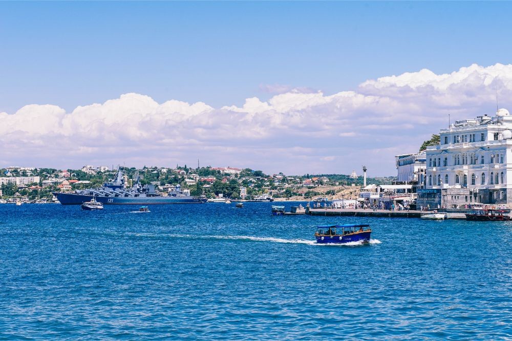 Small Passenger Boat Floating Through the Sea in Sevastopol