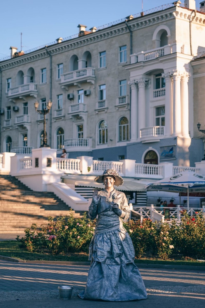 Street Performer Waving at the Camera