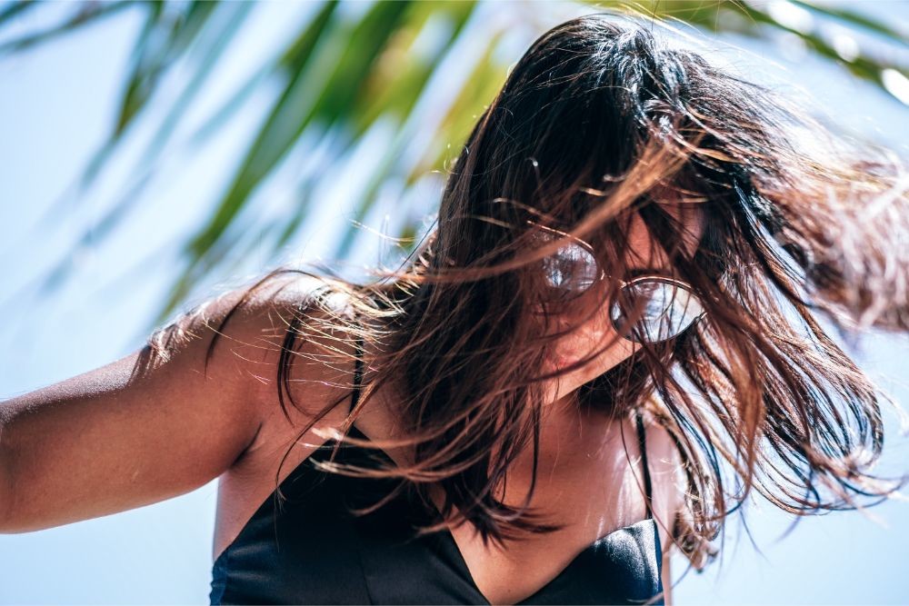 Thai Woman Wearing Sunglasses and Posing in the Sun