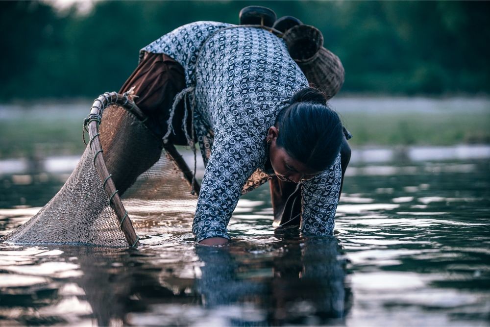 Woman Fishing By Hands