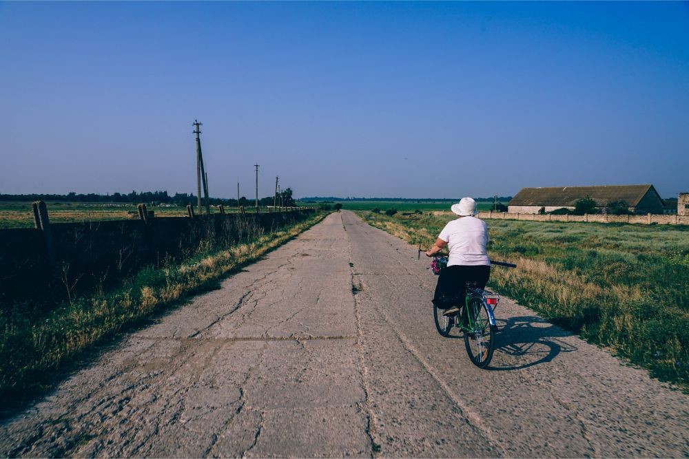 Woman Riding a Bike in a Russian Country Side