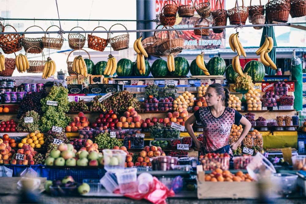 Young Girl Selling Fruit at the Farmers Market