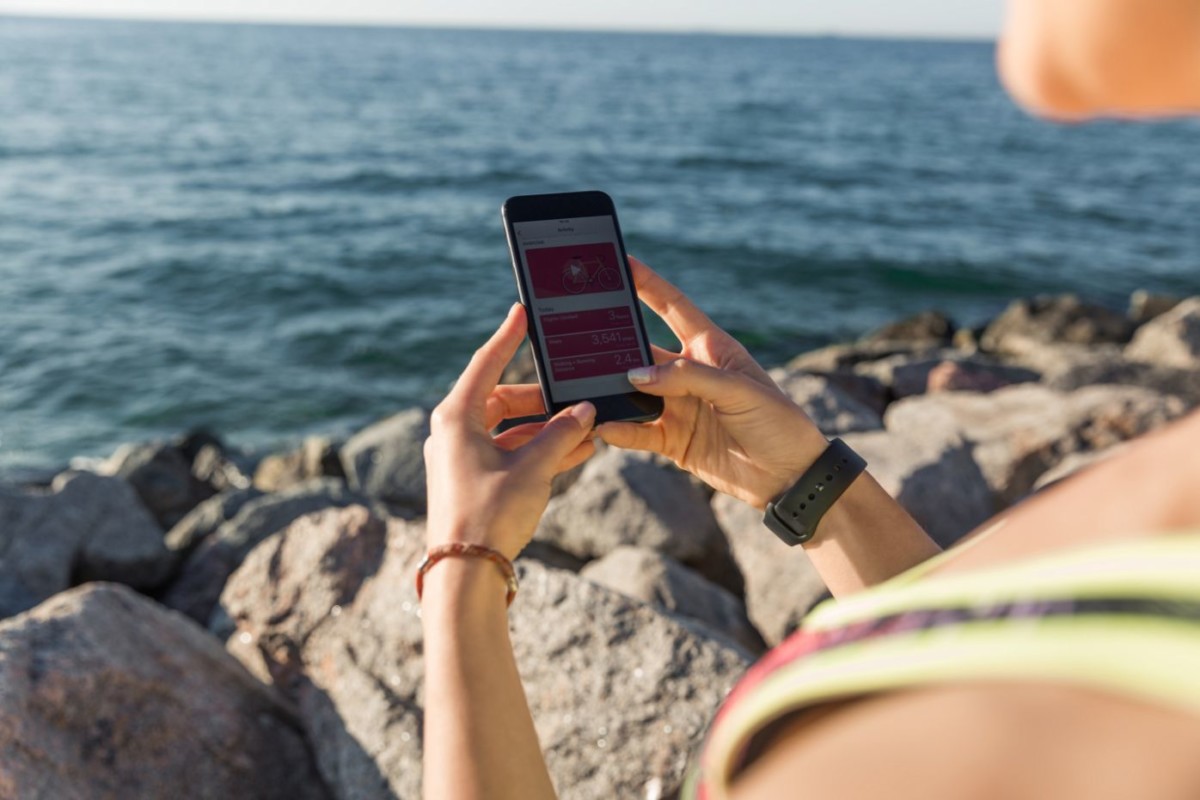 close up of a female fitness runner tracking her PGHMB