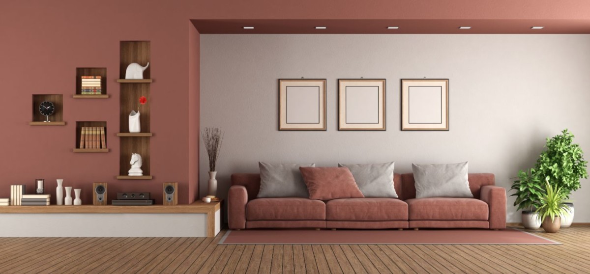 modern living room with sofa and niche on wall XBQPLFC