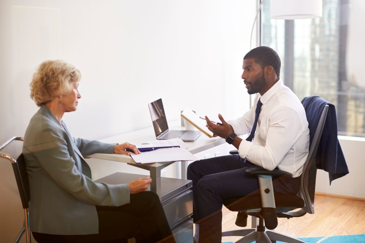 senior woman meetings with male doctor financial HJRKUS