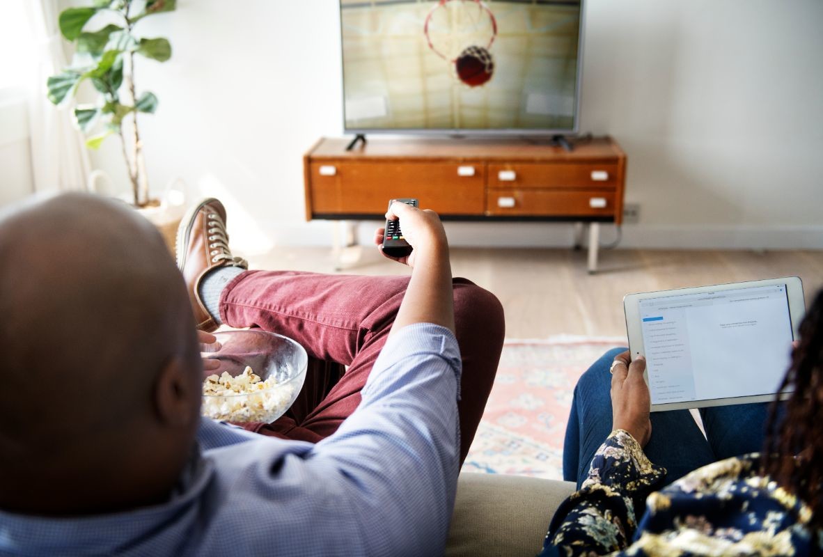 couple watching tv at home together PCXMD